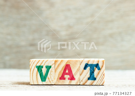 Alphabet letter block in word vat (abbreviation of value added tax) on wood background 77134327