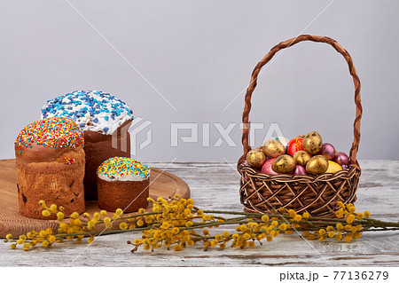 Sweet easter cakes with eggs and willow. 77136279