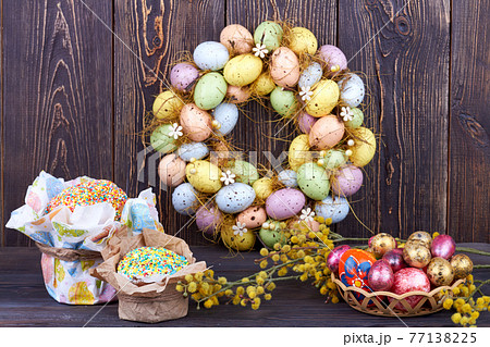 Still life easter symbols on rustic background. 77138225