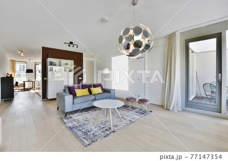 Living room with stylish furniture and lamp Living room with stylish furniture and lamp 77147354