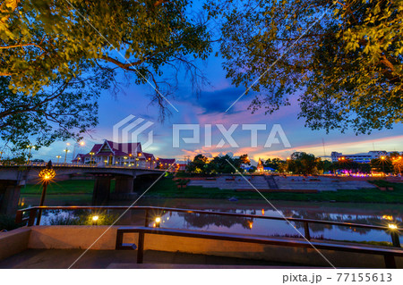 Natural evening In front of the at Wat Phra Si Rattana Mahathat also colloquially referred to as Wat Yai at view the Nan River and  the park for relaxing walking at sunset in Phitsanulok, Thailand. 77155613
