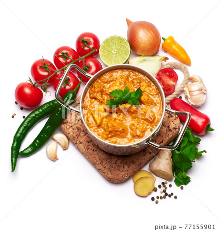 Pot of Traditional Chicken Curry and set of spices on white background Pot of Traditional Chicken Curry and set of spices on white background 77155901