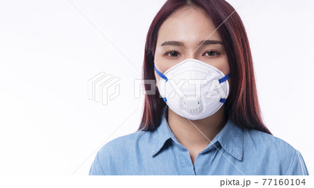 Protection flu outbreak or air pollution pm2.5 healthcare concept. Young woman wear face mask n95 Protection flu outbreak or air pollution pm2.5 healthcare concept. Young woman wear face mask n95 77160104