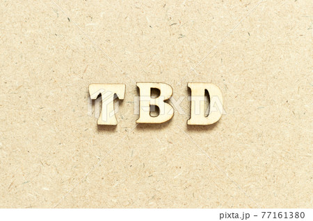Alphabet letter in word TBD (Abbreviation of to be defined, discussed, determined, decided, deleted or declared) on wood background 77161380
