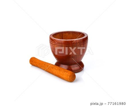 Wooden mortar and pestle on white background 77161980
