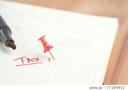 tax day concept with red push pin on calendar date  77164932