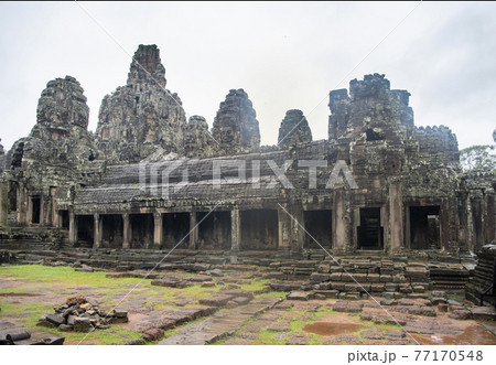 Bayon the central temple of Angkor Thom, late 12th century. It rains in the rainy season. (Cambodia, 04.10. 2019) Bayon the central temple of Angkor Thom, late 12th century. It rains in the rainy season. (Cambodia, 04.10. 2019) 77170548