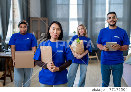 A group of people brought food and clothes to disable person A group of people brought food and clothes to disable person 77172504