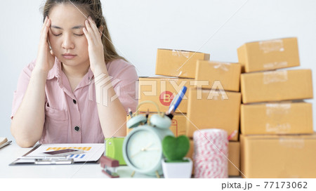 Young woman sitting on a desk is sad or depressed about a sales business, Anxiety and disappointment, business is failing or is on the verge of bankruptcy ,Desperate, stressed, helpless, dead end. Young woman sitting on a desk is sad or depressed about a sales business, Anxiety and disappointment, business is failing or is on the verge of bankruptcy ,Desperate, stressed, helpless, dead end. 77173062