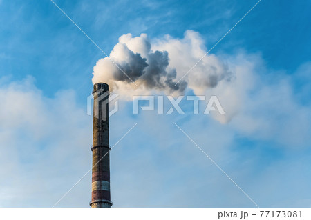 Smoking factory chimneys with co2 emissions.Environmental problem of environmental and air pollution.Climate change,ecology, global warming.The sky is smoky with toxic substances.Soot from factories 77173081