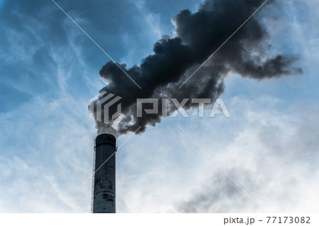 Smoking factory chimneys with co2 emissions.Environmental problem of environmental and air pollution.Climate change,ecology, global warming.The sky is smoky with toxic substances.Soot from factories 77173082