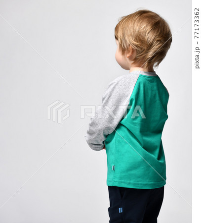 Little preschool toddler boy showing growth up 77173362