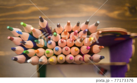 A set of colored pencils, stationery. A lot of multicolored pencils on the table. A set of colored pencils, stationery. A lot of multicolored pencils on the table. 77173376