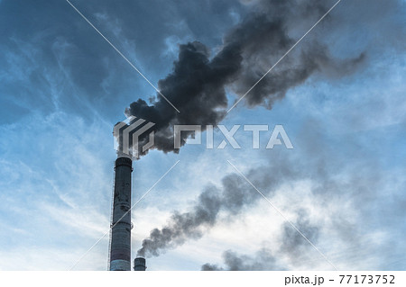 Smoking factory chimneys.Environmental problem of pollution of environment and air in large cities.Climate change,ecology and global warming.The sky is smoky with toxic substances.Soot from factories 77173752