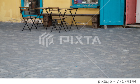 Image of the street cafe and cobblestone Image of the street cafe and cobblestone 77174144