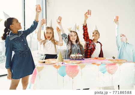 Group of kids celebrate birthday party Group of kids celebrate birthday party 77186588