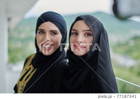 Portrait of young muslim women on the balcony Portrait of young muslim women on the balcony 77187341