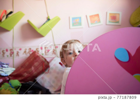 cute little one year old baby and making first steps 77187809