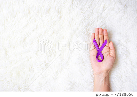 Pancreatic Cancer, world Alzheimer, epilepsy, lupus and domestic violence day Awareness month, Woman holding purple Ribbon for supporting people living. Healthcare and World cancer day concept 77188056