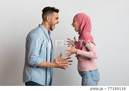 Relationship Crisis. Angry Islamic Spouses Shouting At Each Other With Rage Relationship Crisis. Angry Islamic Spouses Shouting At Each Other With Rage 77189116