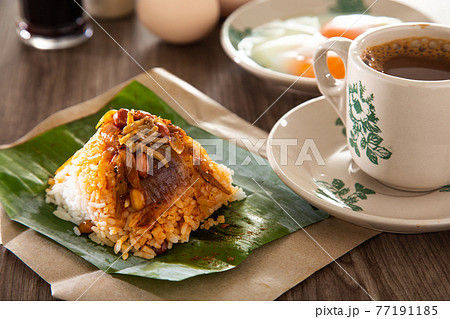 Oriental breakfast set in Malaysia consisting of coffee, nasi lemak, toast bread and half-boiled egg Oriental breakfast set in Malaysia consisting of coffee, nasi lemak, toast bread and half-boiled egg 77191185