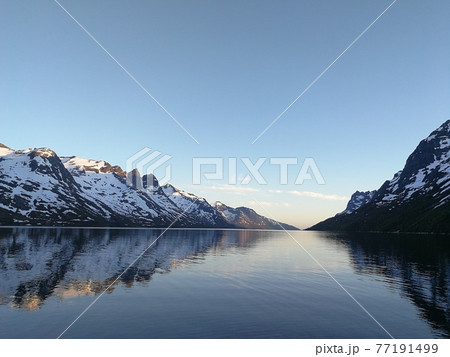 Northern landscape with mountains at the foreground and mountain peak Troms County, Norway. 77191499