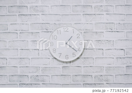 Clock wall hanging brick background Clock wall hanging brick background 77192542