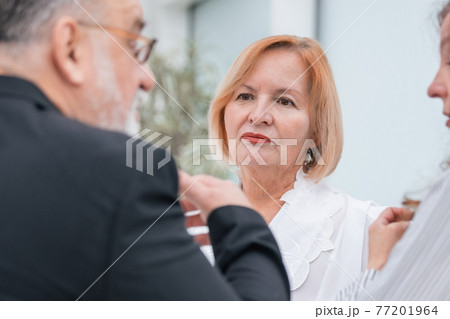 close up. serious business colleagues talking about something in the office 77201964
