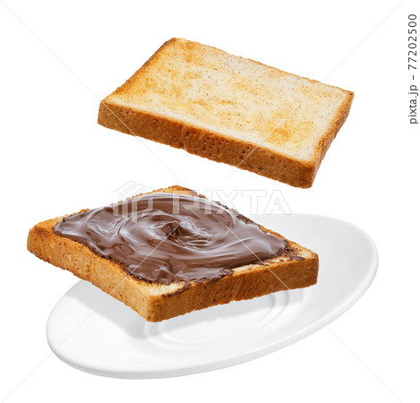 flying bread with chocolate cream isolated on white flying bread with chocolate cream isolated on white 77202500