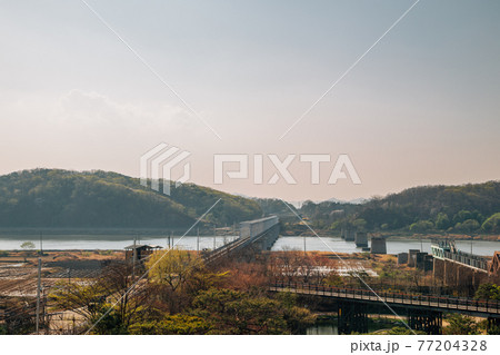 Imjingang River and mountains from Imjingak Pyeonghoa-Nuri park in Paju, Korea 77204328