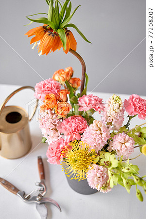 Finished flower arrangement in a vase for home. Flowers bunch, set for interior. Fresh cut flowers for decoration home. European floral shop. Delivery fresh cut flower. 77208207