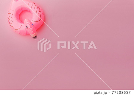 Summer beach composition. Simply minimal design with Inflatable flamingo isolated on pastel pink background. Pool float party, trendy celebrity fashion concept. Flat lay top view copy space. Summer beach composition. Simply minimal design with Inflatable flamingo isolated on pastel pink background. Pool float party, trendy celebrity fashion concept. Flat lay top view copy space. 77208657