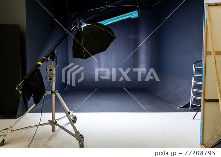 Empty photo studio with lighting equipment. Photographer workplace interior with professional tool set gear. Flash light black background scenes ready for studio shooting. Modern photographer studio Empty photo studio with lighting equipment. Photographer workplace interior with professional tool set gear. Flash light black background scenes ready for studio shooting. Modern photographer studio 77208795