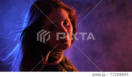 Strong colorful portrait shot of a young woman Strong colorful portrait shot of a young woman 77209695