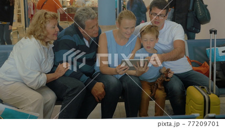 Big Family with Tablet in Waiting Room 77209701