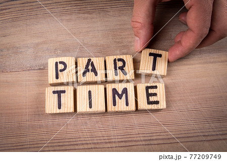 PART TIME. Alphabet letters on a wooden background 77209749