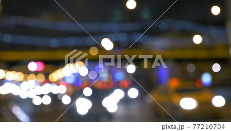 Blurred lights of city traffic at night Blurred lights of city traffic at night 77210704