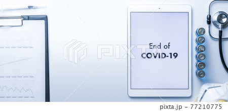 Quarantine is over. Syringe with needle, hospital healthcare charts, doctor stethoscope and white tablet with text on screen for medical equipment background. End of covid concept. Quarantine is over. Syringe with needle, hospital healthcare charts, doctor stethoscope and white tablet with text on screen for medical equipment background. End of covid concept. 77210775