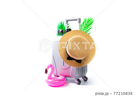 Sea background. Travel accessories with suitcase, straw hat, palm leaves and flamingo in minimal trip vacation concept isolated on white background. Summer vacation and product advertisement concept. Sea background. Travel accessories with suitcase, straw hat, palm leaves and flamingo in minimal trip vacation concept isolated on white background. Summer vacation and product advertisement concept. 77210836