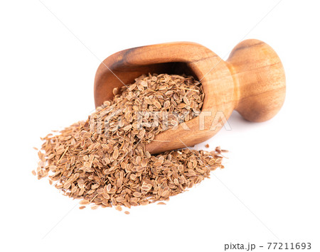 Dill seeds in wooden scoop, isolated on white background. Natural dry dill seeds. Anethum graveolens. 77211693