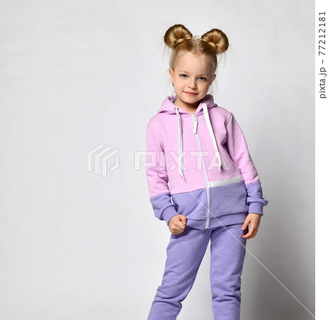 Girl in pink violet sportive suit posing for 77212181