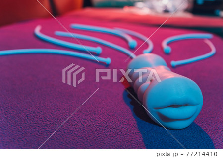 Vibrator for relaxation and pleasure.Vibrator for sex games. Vaginal exercise machines for intimate.Vibrator toys for adults. Sex toys. vibration work and artificial vagina. sex games concept. 77214410