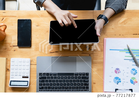 Asian Woman Fund managers analyzing results of research Investment stock market by digital tablet. Asian Woman Fund managers analyzing results of research Investment stock market by digital tablet. 77217877