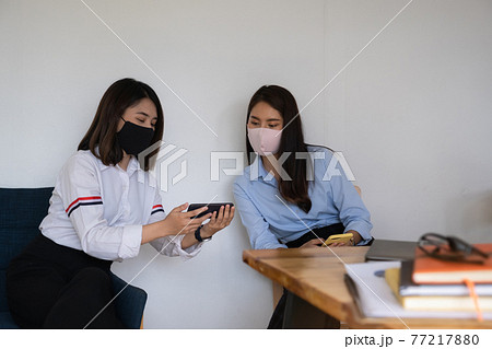 Young student watching electronic breaking news on smartphone in classroom. 77217880
