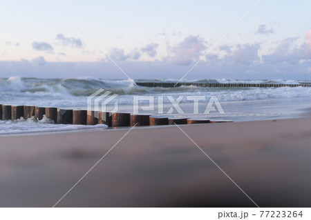 Waves on the sea or ocean panorama. Sunset on the sea. 77223264