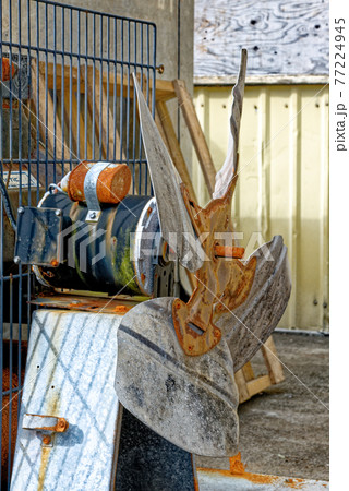 Old rusty discarded air compressor powered by electric motor Old rusty discarded air compressor powered by electric motor 77224945