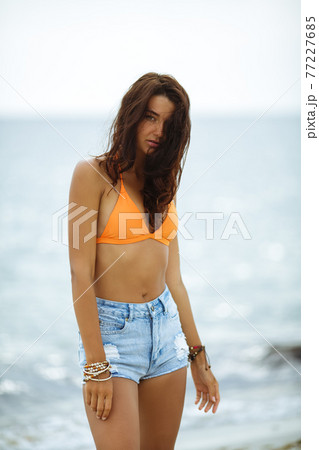 Boho Woman on the Beach near the Sea 77227685