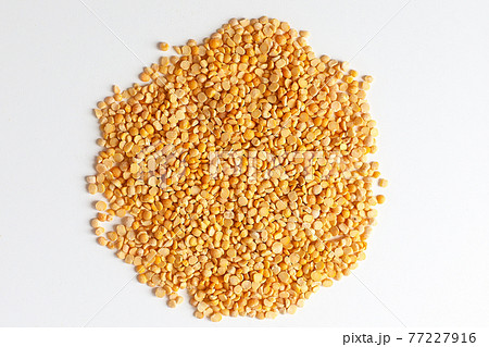 Yellow split peas isolated on white background. 77227916