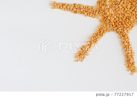 Split peas pile isolated on white background. 77227917
