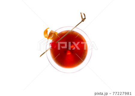 Traditional Manhattan cocktail with cherry isolated on white background Traditional Manhattan cocktail with cherry isolated on white background 77227981